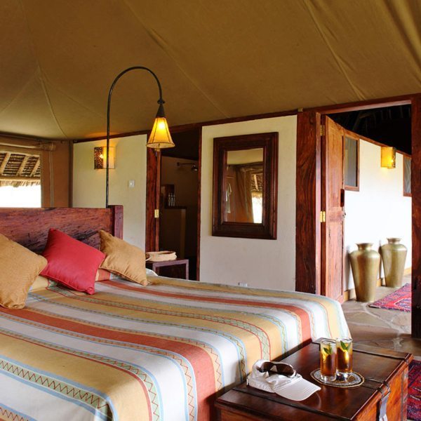 You’ll feel right at home in your spacious tent at Tortilis Camp Amboseli. © Elewana Collection