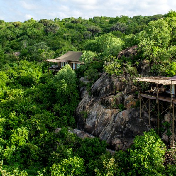 The tented suites at Mwiba Lodge are tucked among boulders overlooking a river gorge.