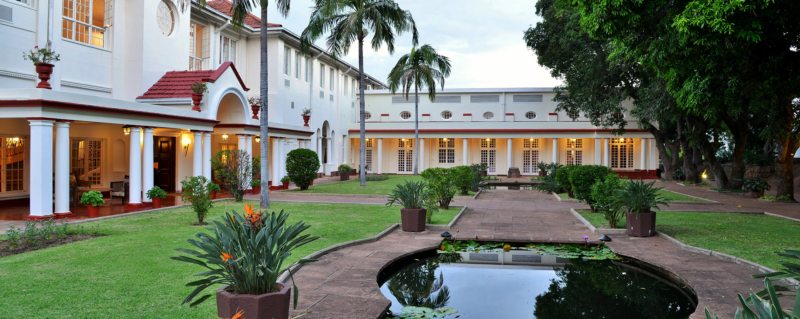 Victoria Falls Hotel faces onto manicured gardens.
