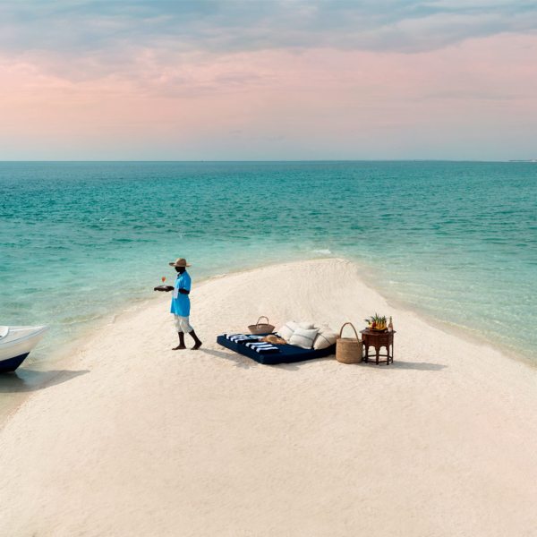 You’ll arrive by boat for your private sandbar picnic in Mozambique.